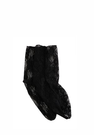 Sorte blonde ankelsokker med blomsterprint, foldet og lagt fladt på en hvid baggrund.