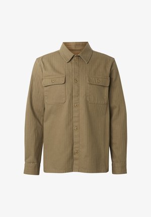 Pitkähiha khakinvärinen paitatakki pystysuorilla raidoilla, napitettavilla sulkimilla, kahdella etutaskulla, joissa napilliset läppät, ja klassisella kauluksella.