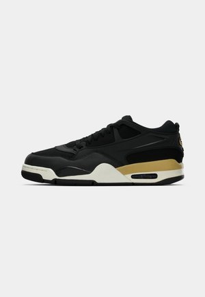 Sort lavtoppet sneaker med guld- og hvid mellemsål, synlig luftdæmpning og snørelukning, vist i sideprofil på hvid baggrund.