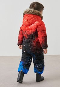 Next STANDARD - Talvihaalari - red galaxy print