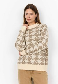Kootud kampsun, millel on hallikirju mustriga houndstooth disain beeži ja kreemjate toonidega. Karm krae ja mansetid, lõdva lõikega, pehme tekstuur.