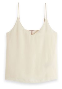 Krémový bezramínkový top s výstřihem do V, vyrobený z hladkého materiálu. Má tenké nastavitelné ramínka a rovný lem.