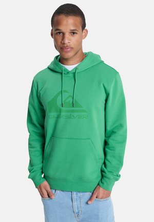Green fleece hoodie featuring a front pocket, drawstring hood, and a large Quiksilver logo in lighter green. Casual fit, soft texture.