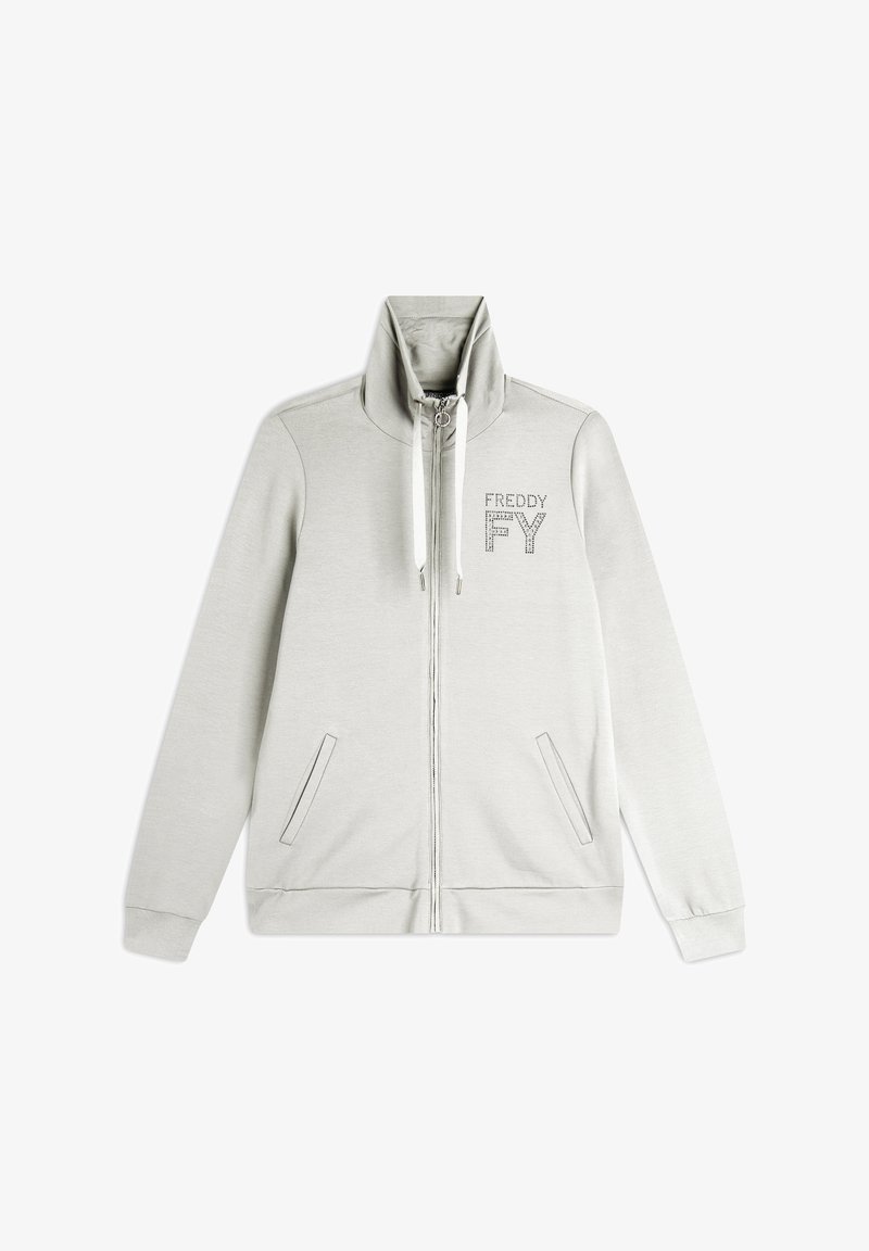 Sweatshirt zippé gris clair avec col haut, poches avant et détails de marquage réfléchissants. Fabriqué en tissu doux et texturé.