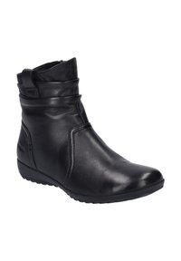 Bottes en cuir noir à la cheville avec un design légèrement décontracté, bout arrondi et semelle en caoutchouc basse ; elles sont dotées d'une fermeture éclair sur le côté et de coutures minimales.
