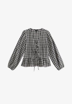 Bluzka peplum w czarno-białą kratę z dekoltem w serek, regulowanym sznurkiem z przodu oraz długimi bufkowatymi rękawami. Wykonana z lekkiej tkaniny.