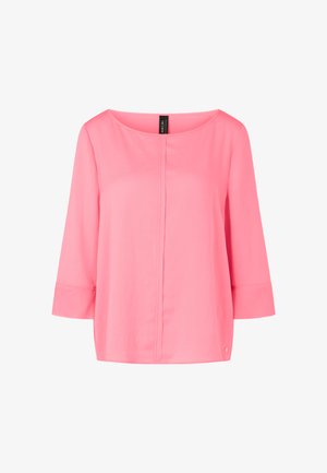 Pink blouse with a loose fit, boat neckline, and three-quarter sleeves. Smooth texture with a central seam and small logo accent at the hem.