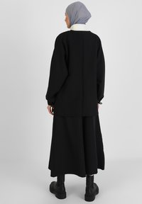 Modanisa SET - A-snit nederdel - black