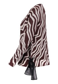 Brun och krämrandig tröja med texturerad stickning och en knytdetalj med svarta accenter i fållen. Långa ärmar och avslappnad passform.