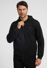 Guess - Mikina na zip - schwarz Miniatura obrázku 1