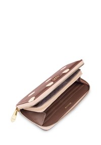 Brown polka dot wallet with a zip closure, featuring interior card slots and a soft, textured finish. Gold-tone hardware accent.