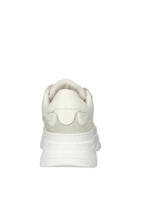 White sneaker with a textured leather and suede upper, rounded heel, and thick white sole. Rear design features stitched accents.