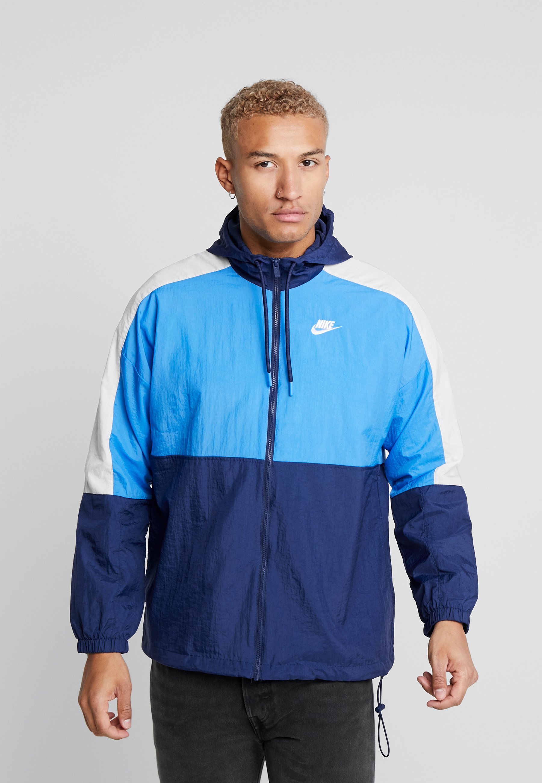 light blue and dark blue nike windbreaker