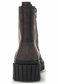 Black leather ankle boots with a high platform sole, featuring a side zipper, textured surface, and contrasting seam details.