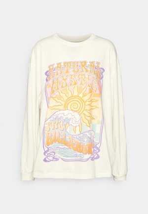 Cream long-sleeve t-shirt featuring colorful graphic design with "NATURAL MYSTIC," sun, waves, and '93 BILLABONG' in bold lettering.