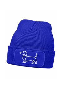 Blue knitted beanie hat with ribbed texture featuring a white outline of a dachshund on a rectangular patch. Fits snugly on the head.