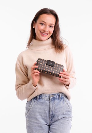Black wallet with a geometric pattern in metallic gold, featuring a rectangular clasp and smooth texture, held by a person in a beige sweater.