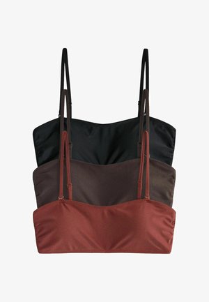Tres tops cortos tipo camisola con tirantes finos apilados verticalmente en colores negro, marrón oscuro con textura acanalada y rojo óxido.
