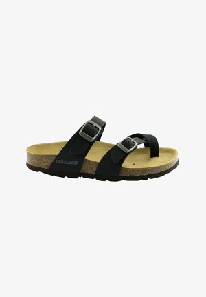 Sandali neri con due cinturini regolabili, soletta in sughero e suola testurizzata. Presentano fibbie in metallo e un design sagomato per il comfort.