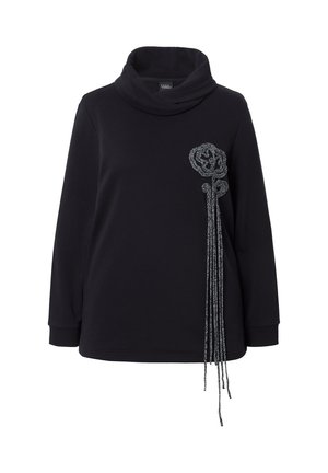 Sweatshirt noir à col cowl avec des manches longues, présentant un motif floral texturé argenté sur le côté gauche et de longs détails à franges.