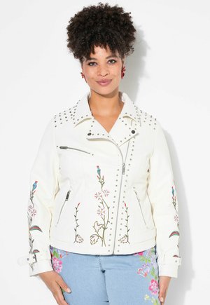 White faux leather biker jacket with silver studs, floral embroidery on sleeves, and zippered pockets. Collar and asymmetrical front closure.