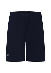 Pantaloni corti blu navy con una cintura elastica, realizzati in un tessuto liscio. Presentano un piccolo logo verde sulla parte inferiore della gamba sinistra.