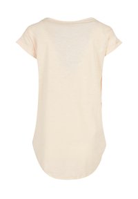 Light beige T-shirt with a relaxed fit, rounded neckline, and short rolled sleeves. Soft texture and slightly elongated back hem.