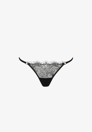Black lace thong with floral pattern, scalloped edges, thin side straps, and small gold ring accents on a white background.