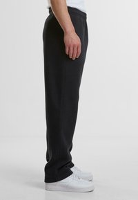 Urban Classics Tracksuit bottoms - black