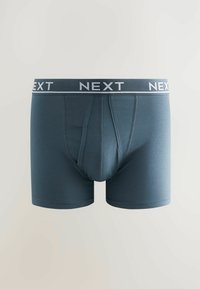 Boxers en mélange de coton bleu foncé avec une ceinture élastique grise contrastante arborant la marque "NEXT". Jambes arrondies, texture lisse.