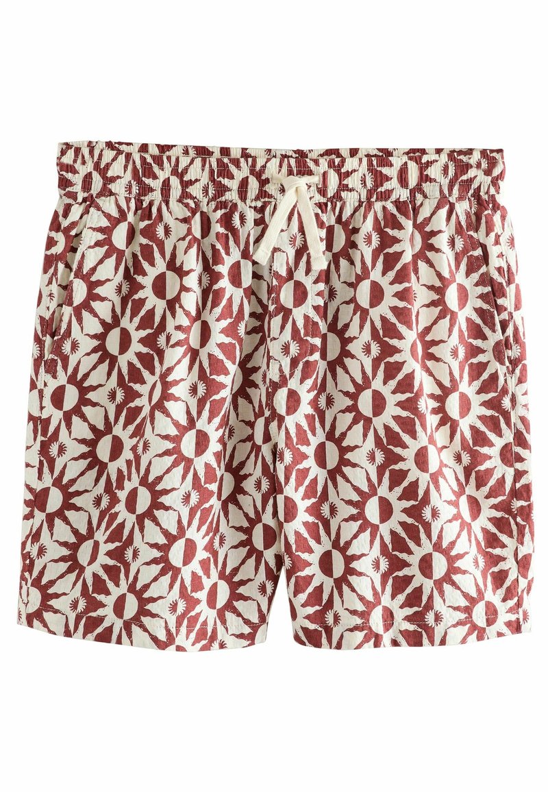 Shorts homme avec taille élastique, cordon blanc et motif soleil rouge et blanc sur toute la surface.