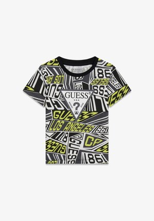 Otroška kratka majica s kratkimi rokavi s črno-belim in neonsko rumenim geometričnim vzorcem besedila ter osrednjim trikotnikom z logotipom Guess.