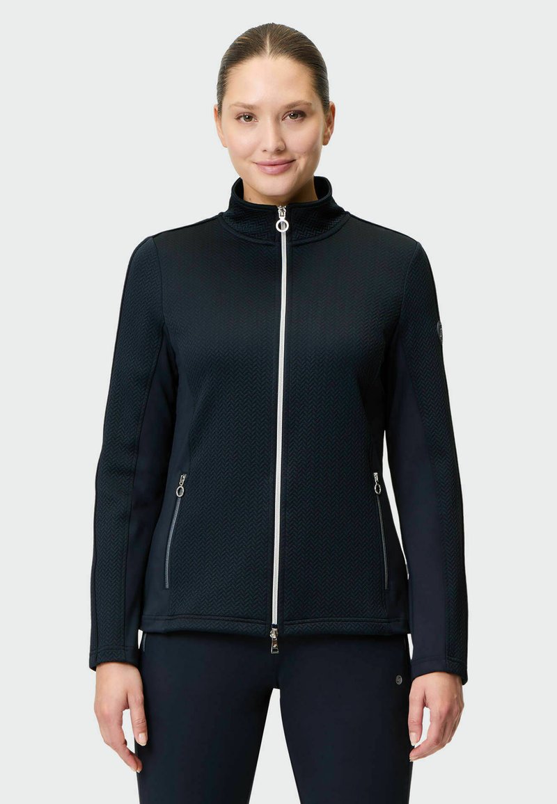 Black knit jacket with high collar, full zip front, and herringbone texture. Features zippered pockets and soft, smooth fabric.