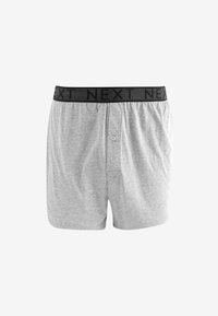 Graue Baumwoll-Boxershorts mit einem schwarzen elastischen Bund, auf dem der Text "NEXT" in wiederholtem Muster steht. Mit Knopfverschluss vorne.