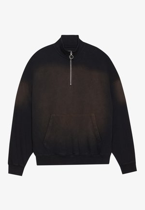 Sweatshirt noir avec col montant, fermeture éclair au niveau du cou, poche avant et dégradé de noir à gris foncé. Tissu doux, coupe décontractée.
