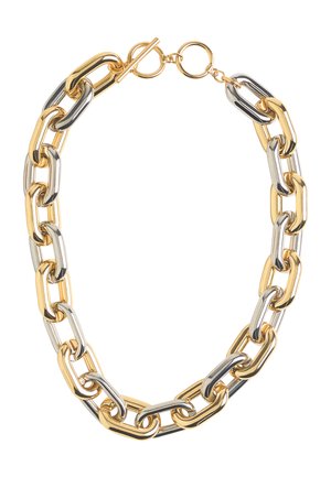Naszyjnik z łańcuszka z metalu złotego i srebrnego, z owalnymi ogniwami i zapięciem na toggle. Gładka tekstura z naprzemiennie błyszczącymi wykończeniami.
