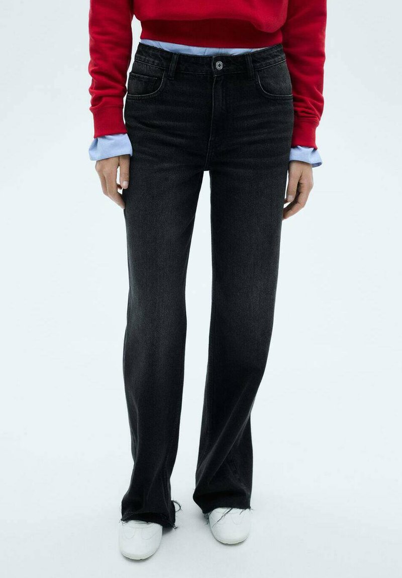 Black denim jeans with a straight-leg cut, featuring front pockets, a standard waistband, and frayed hem detailing.