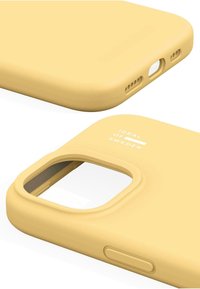 Yellow silicone phone case with a matte finish, cutouts for camera and ports, and embossed "IDEAL OF SWEDEN" logo.