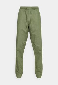 Olivenfarvede afslappede bukser med elastisk talje og snøre, afslappet pasform med tapered ben.