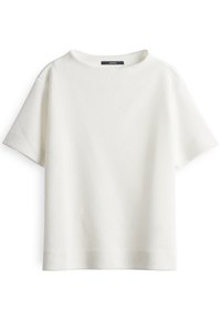 White short-sleeve top with a quilted texture, round neckline, and loose fit. Simple design with no visible patterns or embellishments.