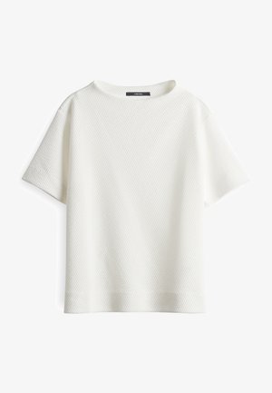 Top bianco a maniche corte con una texture trapuntata, scollatura rotonda e vestibilità ampia. Design semplice senza motivi o decorazioni visibili.