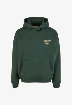 Zeleno bombažno dukserico z sprednjim žepom, kapuco z vrvico in zlatimi logotipnimi podrobnostmi na prsih. Mehak material z rebrastimi manšetami.