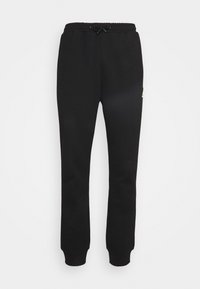 Black sweatpants made of soft fabric, featuring an elastic waistband with drawstring and ribbed cuffs. A small logo accent is on the side.