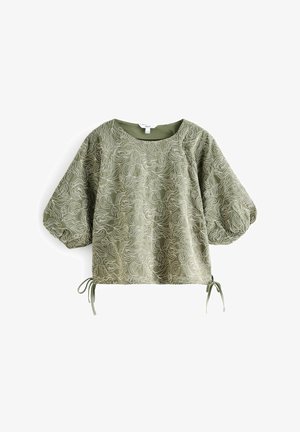 Blusa verde chiaro con un motivo testurizzato a onde, dotata di maniche a palloncino, scollatura rotonda e lacci regolabili all'orlo.