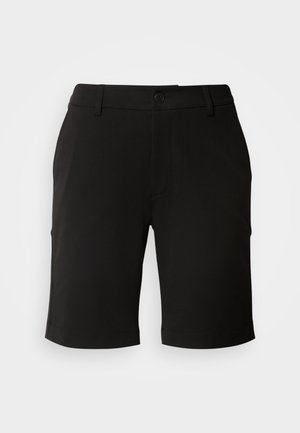 Zwarte shorts gemaakt van zachte stof met een op maat gemaakte ontwerp, met een sluiting met knoop aan de voorkant en twee zijzakken. De zoom is iets omgeslagen.