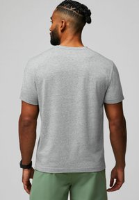 Gray short-sleeve t-shirt made of soft fabric, featuring a classic crew neck design, with a smooth texture and a plain back design.