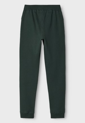 Mørkegrønne slim-fit joggebukser med elastisk talje og manchetter ved anklerne, vist fladt på hvid baggrund.