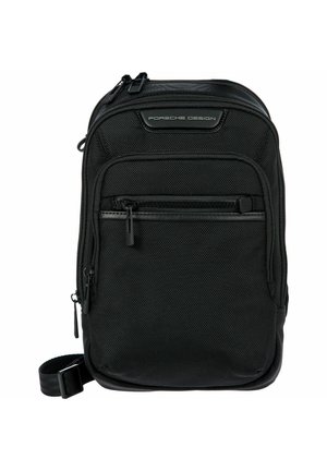 Compact zwarte crossbodytas met meerdere ritsvakken, gestructureerde stof, verstelbare band en Porsche Design-logo aan de voorkant.