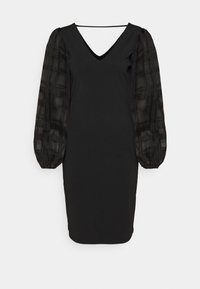 Svart knälång klänning med genomskinliga rutiga puffärmar och djup V-ringning, figursydd silhuett.