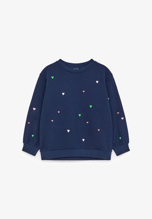 Temno modra jopa z dolgimi rokavi z majhnimi razpršenimi roza, zelenimi in belimi vzorci src, okrogel izrez in rebrasti manšete ter spodnji rob.